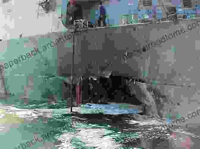 A Damaged Section Of The USS Cole After The Al Qaeda Attack Front Burner: Al Qaeda S Attack On The USS Cole