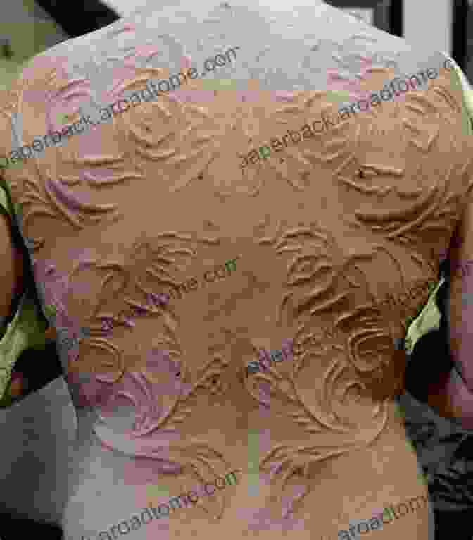 A Detailed Scarification Design Featuring Tribal Patterns On A Person's Back, Showcasing The Intricate And Permanent Nature Of This Form Of Body Modification. Body Modification (Extreme Customs 1)