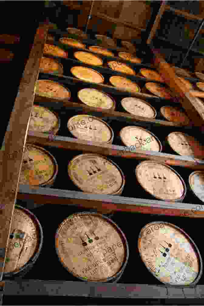 A Row Of Bourbon Barrels Aging In A Limestone Warehouse, Their Presence A Testament To The Close Relationship Between Kentucky Barns And The Bourbon Industry. Kentucky Barns: Agricultural Heritage Of The Bluegrass