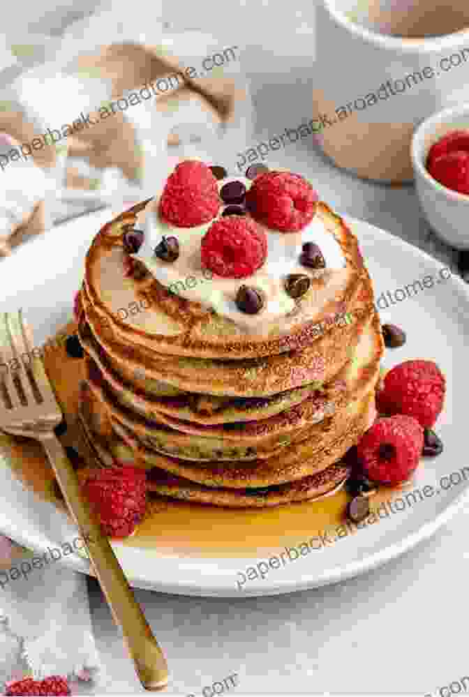 A Stack Of Fluffy Pancakes Made With Almond Flour And Topped With Fresh Berries And A Drizzle Of Maple Syrup Quick And Easy Paleo Breakfast Recipes: Delicious Breakfast Recipes To Eat On The Paleo Diet If You Want To Lose Weight Be Healthy And Make Your Mornings (The Essential Kitchen 14)