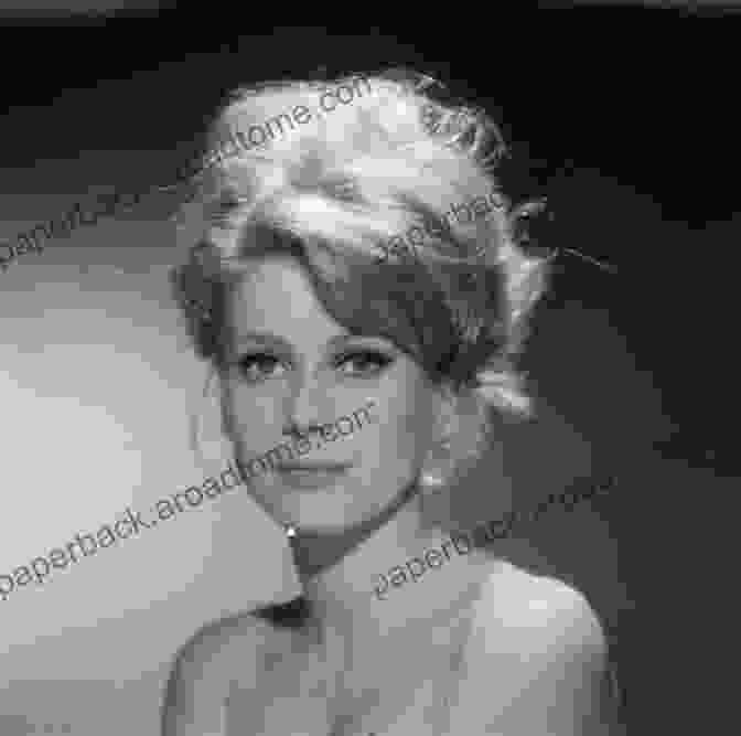 A Stunning Portrait Of Catherine Deneuve, Her Piercing Gaze Captivating The Viewer A Portrait Of Catherine Deneuve