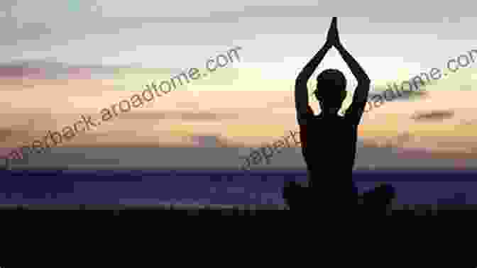 A Woman Practicing Yoga In A Serene Setting, Surrounded By Lush Greenery. She Is Performing A Downward Facing Dog Pose, Stretching Her Entire Body While Calming Her Mind. Essential Yoga Therapy