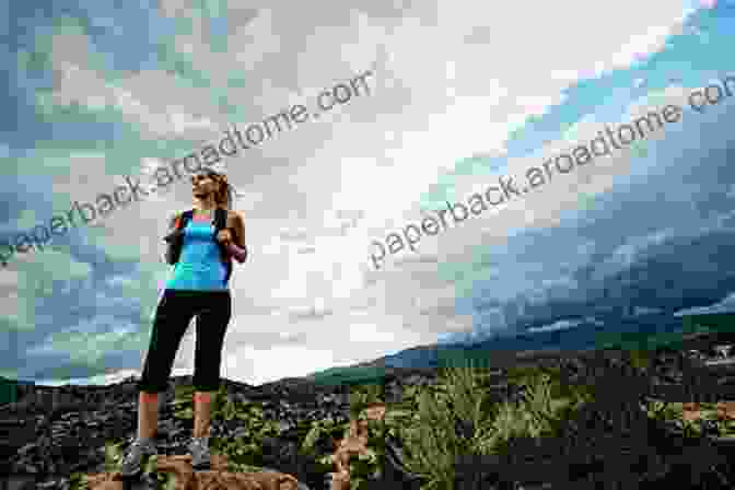 A Woman Standing On A Hilltop, Looking Out At The Vast Expanse Of The American West. Going Out West