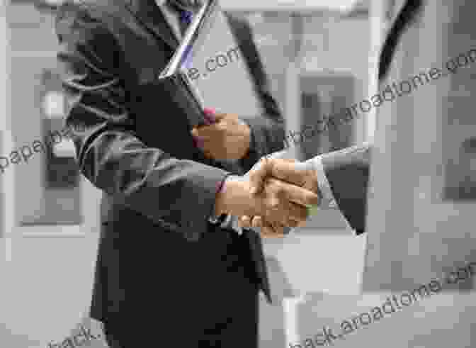 Two Business Professionals Shaking Hands In A Meeting 101 Unspoken Rules Of Etiquette